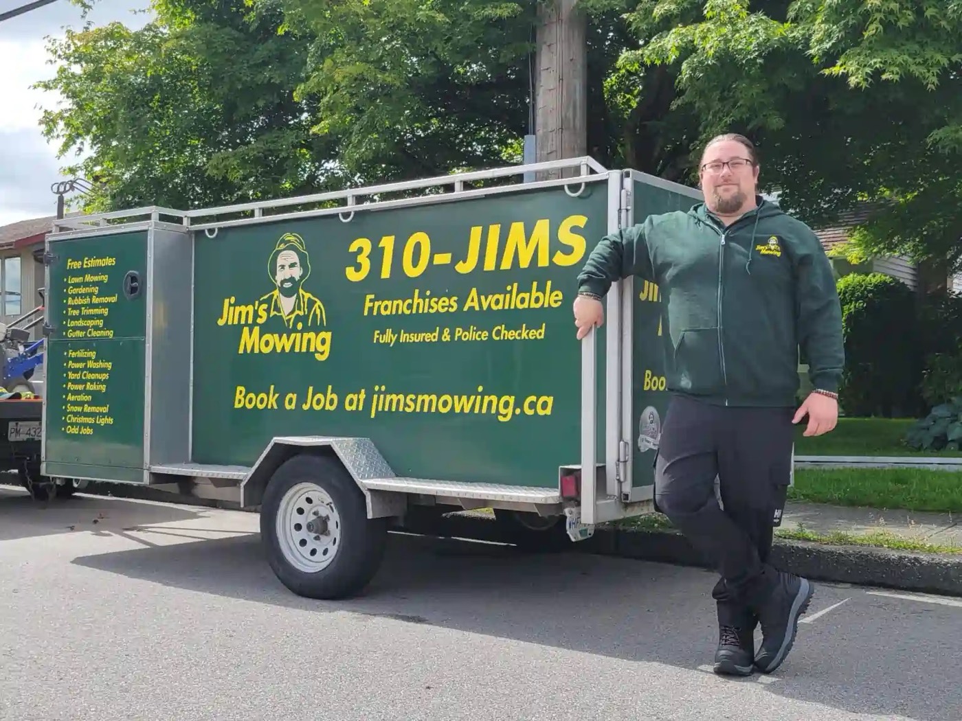 Jim's Mowing trailer and crew